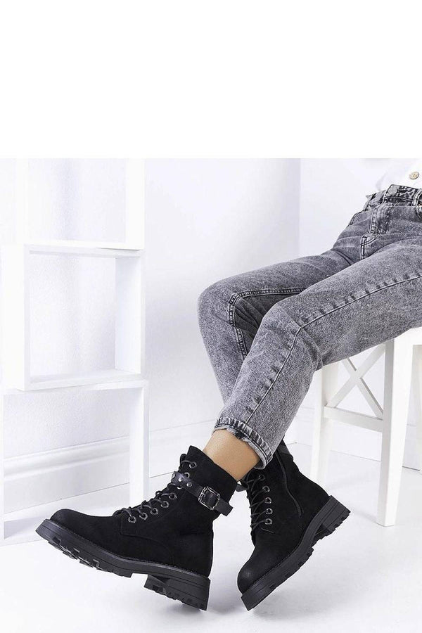 Classic black women's ankle boots with rugged sole and cozy lining, ideal for casual cold-weather outfits and everyday wear.