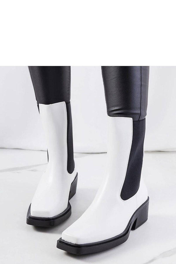 Heel boots - white ankle boots with square toe and block heel, styled with black leggings for autumn fashion appeal.