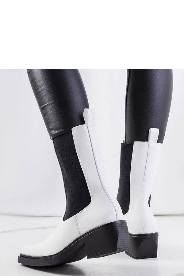 Back view of stylish white ankle boots featuring eco-leather finish and pull tabs, perfect for chic autumn looks.