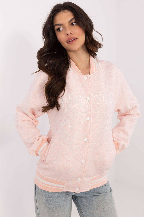 Light pink Women's Bomber Jacket with subtle 'Hamptons NY' embroidery, soft sweatshirt fabric and striped ribbed trim for a feminine touch.