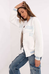 White Women's Bomber Jacket with light blue embroidery, casual sweatshirt style with striped ribbed trim, paired with denim cargo pants.