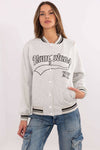 Grey Women's Bomber Jacket with black 'Hamptons NY' text, varsity-style sweatshirt with striped ribbed cuffs and front snap buttons.