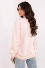 Back view of pastel pink Women's Bomber Sweatshirt with ribbed cuffs and hem, styled with light-wash jeans for a soft casual look.